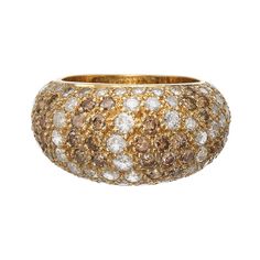 A glittering Cartier bombe ring showcasing approximately 3.5 carats of white and cognac - brown colored diamonds, all pave-set in 18 karat yellow gold. The ring is masterfully crafted by Cartier and its gracefully curving bombe shape allows added exposure of each round brilliant-cut diamond, producing maximum surface sparkle. Owing to its domed shape, it exhibits beautiful volume and presence. The interplay between bright white and natural cognac-hued diamonds gives the ring a distinct vibrant r Gold Cartier Ring, Jeanne Toussaint, Bombe Ring, Buccellati Jewelry, Parisian Jewelry, Cartier Vintage, Cartier Diamond, Man Jewelry, Gem Diamonds