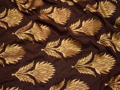 Brown Brocade fabric by the Yard Sewing Indian Making Wedding Dress Banarasi Fabric Crafting Banaras fabric Bridal lehenga Material Fabric. This is a beautiful banarasi blended silk brocade floral design fabric in Brown and Gold. ➤Product: Brocade Fabric ➤Fabric Type: Blended Silk (Viscose and Silk) Fine quality Zari Brocade Weaving from Banaras ➤Color: Brown and Gold ➤Width: 44 inches. ➤Condition: New ➤ Code: bg1442 ➤Listing for 1 Yard of fabric. ➤Care: Dry Clean Only You can use this fabric to Reception Semi-stitched Brocade Saree, Semi-stitched Brocade Saree For Reception, Anarkali Brocade Blouse With Motifs, Brocade Embroidered Fabric Saree For Reception, Brocade Embroidered Fabric For Diwali Reception, Brocade Embroidered Saree For Reception, Unstitched Brocade Blouse Piece For Reception, Gold Brocade Saree With Resham Embroidery, Gold Dupatta With Zari Weaving For Reception