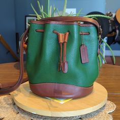 This Vintage Bag Was Produced In 1995 Costa Rica. The Creed Has An Error. It Reads 5cm And It Should Be C5m. There Are Minor Stains And Wear. I Have Used Leather Cpr On This Bag. Designer Green Bucket Bag For Travel, Green Bag With Leather Trim For Shopping, Green Bags With Leather Trim For Shopping, Green Leather Trim Shoulder Bag For Shopping, Green Shoulder Bag With Leather Trim For Shopping, Coach Bucket Bag For Everyday, Everyday Coach Bucket Bag, Coach Brown Leather Bucket Bag, Cognac Bucket Bag For Errands