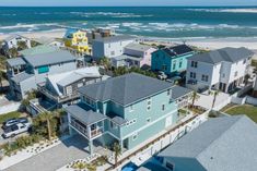 an aerial view of houses on the beach