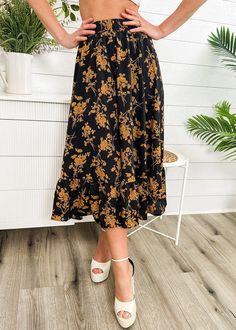 The Emes Shop skirt is detailed with vintage floral prints. Features a high waist. gartered waist. A-line silhouette. and below knee length. Pair it with a puff sleeve blouse and sandals for a classy look.MATERIAL:100% Soft Poly MEASUREMENTS:Dress Length is 31"-33"in Small | Waist: 26"-28"in Medium | Waist: 28"-30"in Large | Waist: 30"-32"in X Large | Waist: 32"-34"in MEASUREMENTS:Dress Length is 78"-83"in Small | Waist: 66"-71"cm Medium | Waist: 71"-76"cm Large | Waist: 76"-81"cm X Large | Waist: 81"-86"cm Flowy Midi Length Bottoms For Day Out, Flowy Midi Skirt For Garden Party, Vacation Midi Length Gathered Skirt, Fall Midi Skirt For Brunch, Midi-length Ruffled Skirt For Day Out, Midi Length Ruffled Skirt For Day Out, Black Floral Print Maxi Skirt For Spring, Long Floral Print Skirt For Brunch, Floral Print Flowy Skirt For Day Out