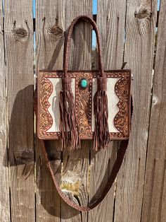 Hand made tote bag with beautiful hand tooling and genuine leather & cowhide. Conceal Carry Hidden Compartment Hidden Compartments, Tooled Leather, Tote Purse, Custom Leather, Leather Tooling, Beautiful Hand, Leather Tote, Purses And Handbags, Shoulder Bags