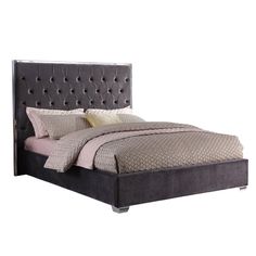 a bed with a gray headboard and pillows on it's sides, in front of a white background