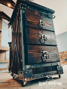 an old wooden chest with metal handles and knobs