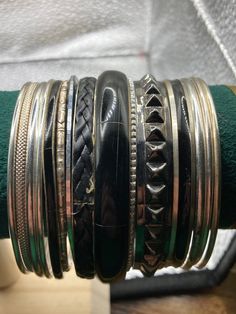 Silver and black tones vintage job lot of stacking bangles Bangle stack metal ethnic eastern brass metal hippy boho festival bracelets You will receive all bangles shown in the pictures .. please measure a similar item as these are all uk standard 65mm internal diameter Vintage Black Bracelet For Festival, Bohemian Stackable Bangle Cuff Bracelet, Bohemian Stackable Bangle Jewelry, Unique Black Adjustable Bangle, Unique Adjustable Black Bangle, Metal Round Bangle For Festival, Round Metal Bangle For Festival, Vintage Adjustable Stackable Cuff Bracelet, Black Metal Festival Bracelets