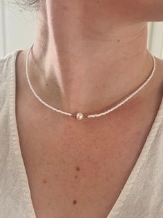 "bead necklace with freshwater pearl ♡ 💦 Waterproof ✅ Hypoallergenic  🛠 Highly Durable Great for layering with other necklaces. Stainless Steel and gold plated so will not fade or tarnish 💦 FREE UK SHIPPING - Upgrade options available 🚚 WORLDWIDE SHIPPING🌎 FREE GIFT WRAPPING🎁  Personalisation available. ECO-FRIENDLY♻️ Chain length: 17\" Share your new jewellery with us on Instagram! @echstudioco ♡ Feel Your Best For A Whole Lot Less♡ Happy shopping💓 Gold Necklace layer. Easter gift 🐣" Minimalist Beaded Necklaces With Pearl Charm, Dainty Beaded Necklaces With Pearl Pendant, Minimalist Pearl Beaded Necklaces With Tiny Beads, Minimalist Beaded Necklace With Pearl Drop, Minimalist Pearl Beaded Necklace With Tiny Beads, Adjustable Pearl Necklace With Tiny Beads For Gifts, Pearl Necklace With Tiny Beads For Gifts, Pearl White Necklace With Tiny Beads For Gift, Dainty Pearl Beaded Necklaces With Tiny Beads