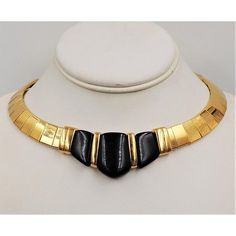 This is part of Chairish’s Costume Jewelry assortment.  Goldtone and black lucite collar necklace with fold over clasp. Marked "Napier." An identical necklace was featured in a 1986 advertisement. Measures: 6 inches long by 5 1/2 inches wide. Center: 1 1/8 inches. Excellent condition.  Please reference the measurements noted in the description above for the best approximate dimensions. Please reach out to the seller under "Ask the Seller" for specific questions regarding the measurements. 90's Fashion, Accessories Jewelry Necklace, Modern Branding, Fold Over, Collar Necklace, 90s Fashion, Costume Jewelry, 6 Inches, Gold Tones