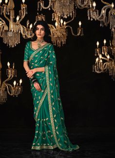 Experience the ultimate luxury with our exclusive Green Glass Tissue Silk! Adorned with delicate embroidered work and a unique stitched border, this piece is sure to make a statement. Elevate your style with Lankans Online Shopping USA. The unstitched blouse can be customized upto 44 inches. Do Note: All the accessories shown are for styling purpose only. Slight color variation may occur due to photographic reasons. Fall and Pico : Done Draping Saree(Ready to wear) : On Request Extra Charges Occ Green Nauvari Saree, Nauvari Saree Blouse, Saree Blouse Design, Nauvari Saree, Blue Weave, Satin Saree, Party Kleidung, Casual Saree, Art Silk Sarees