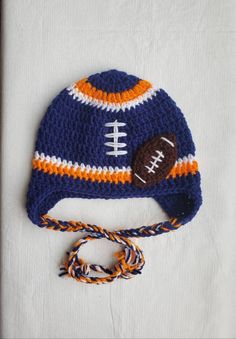 a crocheted hat with a football on it