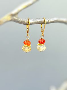 Colorful dangly drop orange Oregon sunstone and yellow citrine dangle earrings in your choice of gold fill, rose gold fill, or sterling silver.  A lovely gift for a mom, wife, or girlfriend. Handmade November birthstone gemstone jewelry for women. Handmade Jewelry crafted with love one at a time in my northern Michigan studio. Gemstones are nature's creations and may vary slightly in color and inclusions, but all are lovely and hand selected to match. These earrings are Dainty approx 1 1/4"  lon Orange Gemstone Dangle Jewelry, Wire Wrapped Citrine Dangle Earrings, Orange Briolette Jewelry For Gift, Nickel-free Citrine Dangle Jewelry, Orange Gemstone Dangle Earrings, Orange Gemstone Drop Earrings, Orange Gemstone Drop Jewelry, Orange Wire Wrapped Earrings For Gift, Orange Drop Gemstone Jewelry