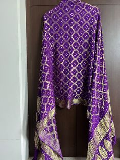 Mothers day special Jaipuri traditional bandhej dupatta ghatchola banarasi zari Dupatta party wear,wedding dupatta charkpiko free Beautiful Rajasthani bandhej with ghatchola dupatta Fabric - Banarasi silk zari dupatta Charkpiko free All colours available Handmade item Heavy Gharchola Bandhani Zari Work Bridal Dupatta , Women Silk Handmade Zari Work Dupatta, Traditional Wedding Dupatta Bandhani Dupatta Silk DM for choosing your color Materials This beautiful deep blue color-rich dupatta is perfec Traditional Purple Bandhani Print Lehenga, Traditional Purple Lehenga With Bandhani Print, Purple Traditional Wear With Bandhani Print, Purple Saree With Gota Work In Traditional Drape, Purple Bandhani Print Traditional Wear For Diwali, Purple Gota Work Saree For Navratri, Purple Saree With Gota Work For Navratri, Purple Bandhani Traditional Wear For Diwali, Purple Saree With Gota Work