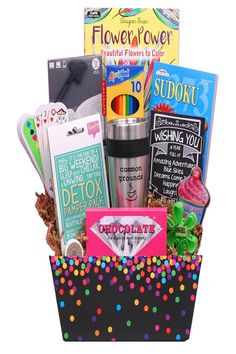 a gift basket filled with lots of goodies and books to give as someone's birthday present