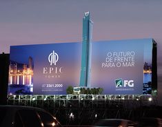 an advertisement on the side of a building for epic tower in mexico city, with cars passing by