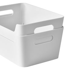 a white plastic storage basket with handles on an isolated white background for product display purposes