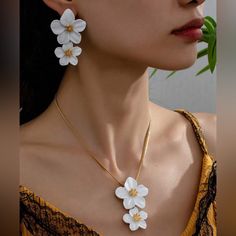 White Flower Earrings And Necklace Set Material: Zinc Alloy, 14k Gold Plated Size: See Photo For Measurements Jeweled Flowers, White Flower Earrings, Crystal Locket, Free People Necklace, White Flower Earring, 10k Gold Chain, Earrings And Necklace Set, Christian Necklace, Sunflower Necklace