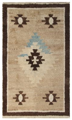 a brown and blue rug with an abstract design