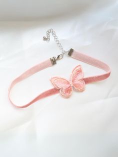 Life is just more magical with our pink butterfly choker necklace. Made for princesses, little ladies, and fashion-loving girls, this must-have accessory is as lovable as your cutie pie.   Clasp and chain link closure offer an adjustable fit that feels comfy even for all-day wear. Just the thing to complete multiple costumes, formal dresses, and make-believe outfits  Pink choker necklace with butterfly accent and clasp closure  Includes one necklace in one size that fits most toddlers and young girls Not intended for sleepwear. Please supervise the child while they are wearing the accessory.