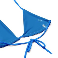 Stay comfortable and beach ready all summer in this FYC String Bikini set. It’s made from soft recycled polyester with double-layering and UPF 50+. Style the straps how you like, and get ready to swim! • Soft and stretchy material with UPF 50+ • Sizes up to 4XL • Bikini top comes with removable padding for comfort • Multiple ways to tie and style the bikini set Disclaimer: To make your All-Over Print Recycled String Bikini last longer, thoroughly rinse it off after each use and get rid of any ch Nylon Swimwear With 4-way Stretch For Water Sports, Beachy Nylon Swimwear For Sunbathing, Adjustable Blue Nylon Swimwear, Adjustable Nylon Swimwear For Poolside, Seamless Nylon Swimwear For Water Sports, Uv Protection Triangle Top Swimwear For Sunbathing, Adjustable Swimwear For Sunbathing Beachwear, Adjustable Straps Beachwear Swimwear, Uv Protection Swimwear With Triangle Top For Swimming