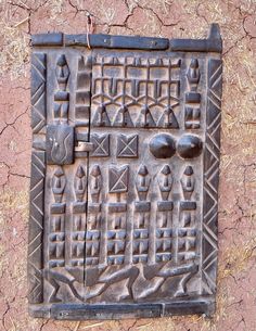 an iron door with many different designs on it