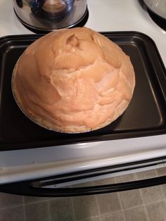 a cake sitting on top of a black pan