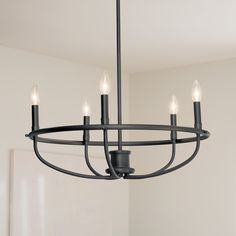 Instantly add dimension to your room with the Bethel collection. Basket-inspired curved arms and modern finishes give Bethel an enviable beauty. Clean, simple and on-trend, this collection is both timeless and timely. Kichler Bethel 5-Light Black Modern/Contemporary Chandelier | 82372 Black Chandelier Over Dining Table, Black Rectangular Chandelier, Timeless Dining Room Lighting, Breakfast Nook Lighting Ideas, Front Entryway Light Fixture, Black Entryway Chandelier, Dining Room Table Light Fixture, Black Light Fixtures, Black Chandeliers