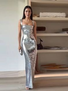 Expertly designed for a stunning and sophisticated look, the Socialite Silver Sequin Cut Out Sleeveless Maxi Dress is a must-have for any glamorous occasion. The intricate sequin detailing adds a touch of sparkle, while the cut-out sleeves and maxi length create an effortlessly chic silhouette. Elevate your style with this elegant dress. 100% Polyester Dry Clean Zipper Closure Due To High Demand-Please Allow 2-3 Weeks For Delivery Brand Size Dress Bust Waist Hip XS 0-2 31-32.5'' 23-24'' 31-34" S Glamorous Sleeveless Cocktail Dress, Sleeveless Sparkling Sequin Dress For Gala, Glamorous Sleeveless Dress For Evening Parties, Sparkling Sleeveless Sequin Dress For Gala, Glamorous Sleeveless Dress For Night Out, Glamorous Sleeveless Evening Dress, Glamorous Sleeveless Sparkling Sequin Dress, Glamorous Sleeveless Dress For Prom And Party Season, Glamorous Sleeveless Prom Dress For Party Season