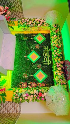 an overhead view of a decorated lawn with flowers and umbrellas