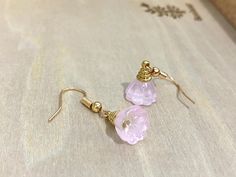 These earrings feature pink Czech Crystal lotus seed pods. The ear wires are brass filled 14k gold plated. Suitable for any occasion! Perfect as a gift for your loved one, mother, and friends!  Size: 1cm x 3 cm  *Please note that there might be slight variation in the colour and size (1-2mm) of the lotus pod* ---------------------------- 🌟Maintenance  - To prevent tarnishing, place the item in a zipped bag and box when not using. 🌟Follow us on Instagram and tag us to be featured : @katecraftsxx 🌟Please check out more design in our shop: https://www.etsy.com/ca/shop/Katelifestyle  ---------------------------- Please feel free to contact me with any questions!  Thank you for visiting Katelifestyle.  Hope you will come again! Kate xoxo Wire Wrapped Rose Gold Earrings For Gift, Pink Wire Wrapped Earrings For Gift, Wire Wrapped Dangle Flower Earrings For Gift, Wire Wrapped Dangle Flower Earrings As Gift, Gold Wire Wrapped Flower Earrings Gift, Gift Crystal Flower Earrings With Ear Wire, Handmade Pink 14k Gold-filled Earrings, Handmade Pink 14k Gold Filled Earrings, Rose Gold Crystal Earrings With Ear Wire As Gift