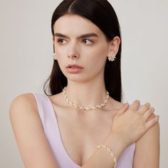 This stunning piece features a seamless fusion of delicate gold beads, creating a mesmerizing interlocking pattern. Crafted with precision and attention to detail, this choker necklace exudes elegance and sophistication, adding a touch of luxury to any ensemble. Elevate your look with this versatile accessory, perfect for both casual and formal occasions. Metal: 14K Gold Filled Gemstone: Freshwater Pearl Length: 350mm(Includes extension chain 50mm) Width: 8mm(including metal parts) Interlocking Pattern, Choker Pearl, Gold Beads, Freshwater Pearls, Gold Filled, Choker, Choker Necklace, Beads, Gemstones