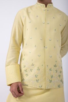 Yellow bam silk kurta with thread embroidered cuffs. Comes with ivory cotton silk pyjama and a suiting bundi jacket with cutdana work. - Aza Fashions Spring Cotton Silk Sherwani With Zari Work, Fitted Cotton Silk Bandhgala For Festivals, Fitted Cotton Silk Bandhgala For Wedding, Fitted Chanderi Nehru Jacket For Spring, Spring Silk Bandhgala With Zari Work, Fitted Cotton Silk Sherwani With Chikankari Embroidery, Spring Cotton Silk Sherwani With Chikankari Embroidery, Fitted Cotton Silk Bandhgala With Cutdana, Fitted Silk Nehru Jacket For Transitional Season