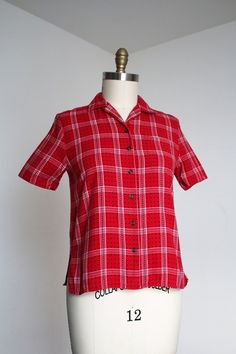 Really great cotton flannel button up top from the 1950s.  Label: none - likely homemade Measurements: { medium } Bust: 38"  Length: 23" Sleeve Length: 9" Condition: excellent vintage condition with minor signs of wear - sold as found. washed and ready to wear ☆Shop more☆ http://www.trunkofdresses.com/ Fashion 1940s, Womens Blouses, Plaid Top, Button Up Top, 50s Fashion, Plaid Tops, Cotton Blouses, Cotton Flannel, Plaid Flannel