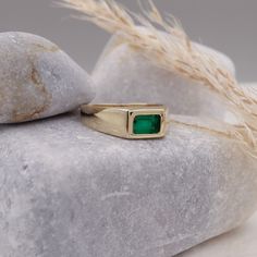 This 14k Natural Emerald Baguette Signet Ring is an exquisite piece of May birthstone jewelry. Crafted with precision, this ring showcases a vibrant green natural emerald stone, symbolizing youth and rejuvenation. Designed to suit both men and women, it serves as a versatile accessory, perfect for any occasion. The chunky yet elegant design adds a touch of sophistication, while the pinky ring style adds a trendy element. Whether it's an anniversary celebration or a special gift, this ring makes a truly timeless and meaningful statement. Elevate your jewelry collection with this mesmerizing emerald signet ring. Measurements: * Gem Stones: 100% Natural Emerald * Center Stone Measurements: 6.00x4.00 Approx. 0.50 * Color and Clarity: Clear Green * Material: High-Quality Solid Gold 14/18k ----- Emerald Stone Rings For Men, Emerald Signet Ring Men, Men's Sapphire Ring, Timeless Green Jewelry With Bezel Setting, Timeless Green Baguette Cut Ring, Classic Green Everyday Jewelry, Green 14k Gold Emerald-cut Rings, 14k Gold Emerald Cut Rings For May Birthstone, Classic Green Rings For Everyday