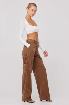 Loose fit cargo style pant Button fly zipper closure Fabric: 100% Polyester Machine wash with similar colors, tumble dry Model Measurements: Height: 5'7, Bust: 32B, Waist: 24/25", Hips: 34" Model is wearing a size XS Made in Los Angeles Fall Work Pants With Multiple Pockets And Wide Leg, Fitted Wide Leg Pants With Flap Pockets, Fitted Wide-leg Pants With Flap Pockets, Fall Utility High-waisted Cargo Pants, Fall Utility Wide Leg Cargo Pants, Brown High-waisted Cargo Pants With Pockets, Fitted Wide Leg Bottoms With Flap Pockets, Fall Utility High-waist Parachute Pants, Utility High Waist Parachute Pants For Fall