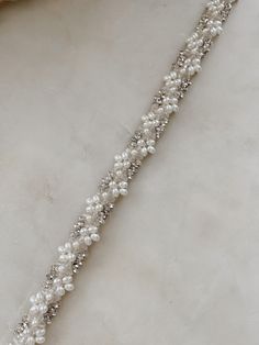 Beautiful clustered pearls and crystals on ribbon ties. We love this modern but classic design. Elegant Silver Bridal Belt With Pearl Embroidery, Elegant Pearl Embellished Bridal Belt, Luxury Hand-strung Pearl Bracelets, Elegant Hand-strung Pearl White Bracelet, Luxury Silver Beaded Bridal Belt, Pearl Veil, Veil Headpiece, Ribbon Tie, Everyday Jewelry