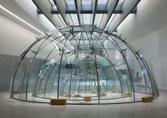 the inside of a building with glass walls