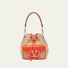 Valentino Garavani "Loco" bucket bag in polyester, metal, and raffia  Detachable flat top handle  Detachable, adjustable web shoulder strap Can be worn as a top handle or shoulder bag  Drawstring closure  Exterior, VLOGO front flap pouch  Lining: Cotton Approx. 7.5"H x 6.3"W x 4.3"D Made in Italy Designer Top Handle Bucket Bag For Errands, Designer Bucket Bag With Handles For Errands, Designer Bucket Bag With Detachable Handle, Designer Tote Bucket Bag With Detachable Handle, Designer Bucket Satchel With Handles, Designer Bucket Bag With Detachable Strap And Top Handle, Designer Crossbody Bucket Bag With Detachable Handle, Designer Bucket Hobo Bag With Removable Pouch, Designer Hobo Bucket Bag With Removable Pouch