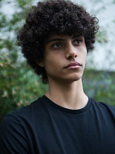 a close up of a person wearing a black shirt