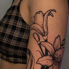 a woman's arm with flowers on it