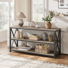 a living room scene with focus on the bookshelf and table in the foreground