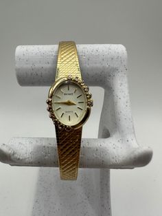 Behold the rare and exquisite Nicolet vintage ladies diamond Quartz watch in a captivating gold tone - an exceptional gift for her. This fashion designer timepiece features a tastefully adjustable strap, ensuring a perfect fit for any wrist. In good shape and adorned with diamonds, it radiates timeless allure. Fitted with a new battery, this watch seamlessly combines style and functionality, making it an extraordinary accessory for women with a discerning taste for unique and elegant pieces. Comes with a Swiss eta movement  Please message me with any questions Gold Watches With Diamond Accents For Formal Occasions, Classic Gold Watches With Diamond Accents, Formal Gold Watches With Diamond Accents, Yellow Gold Watches With Diamond Accents For Gift, Yellow Gold Watches With Diamond Accents As Gift, Classic Gold Diamond Watch For Anniversary, Formal Diamond Watch With Metal Dial, Gold Diamond Watch With Accents, Gold Diamond Watch With Diamond Accents