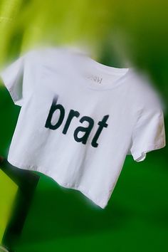 Bumpin' that in this Charli XCX Brat graphic baby tee. Designed in a slim & cropped fit so when you’re looking in the mirror you like what you see. Only at Urban Outfitters. Features Charli XCX Brat graphic baby tee Fitted graphic tee Soft and stretchy knit Crew neckline with short sleeves Brat graphic across the chest Slim fit Cropped length Easy pull-over style UO exclusive Content + Care 100% Cotton Machine wash Imported Size + Fit Model in Green is 5'9" and wearing size Small Measurements taken from size Small Chest: 32" Length: 16.5" | Charli XCX UO Exclusive Brat Graphic Baby Tee in White, Women's at Urban Outfitters