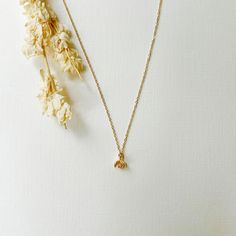 Our dainty 14K gold filled flower necklace is the perfect year round accessory and can be worn alone or layered with other chains. Flower charm is three dimensional, lightweight, and a delicate addition to any outfit. 16 inch chain length with extender chain. THE DETAILS -Shipped via USPS with tracking -14K gold filled chain and clasps Dainty 16-inch Charm Necklace For Everyday, Adjustable Yellow Gold Delicate Charm Necklace, Minimalist Yellow Gold Necklace With Flower Charm, Dainty Charm Necklace With Adjustable Delicate Chain, Dainty Yellow Gold Flower Necklace With Clavicle Chain, Adjustable Dainty Charm Necklaces, Dainty Gold Plated Flower Necklace, Dainty 16-inch Yellow Gold Charm Necklace, Dainty 14k Gold Filled Necklaces