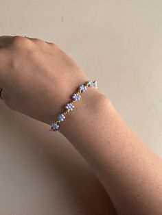 This is a beautiful flower bracelet in blue and gold pearls! Please message me if you have any questions! Cheap White Flower Beaded Bracelets, Cheap White Flower Bracelets, Flower Pearl Bracelet, A Beautiful Flower, Flower Bracelet, Blue And Gold, Gold Pearl, Beautiful Flower, Pearl Bracelet