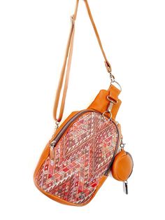 Handcrafted with quality full-grain leather, this crossbody sling bag features a zip-top closure and an interior pocket to keep your everyday essentials secure yet accessible and a small coin purse attached. This bag can be worn across the body (sling) or as a mini backpack. The interior of the bag is lined with beautiful, newly handwoven artisan fabric. Artisan embroidered up-cycle fabric in the outside, making every bag unique. Every bay is one-of-a-kind and slow-crafted by leather artisans in Brown Crossbody Saddle Bag With Zipper, Camel Shoulder Bag With Zipper Closure, Camel Crossbody Shoulder Bag For On-the-go, Travel Crossbody Chest Bag With Detachable Strap, Versatile Brown Crossbody Chest Bag, Camel Shoulder Bag With Zipper For Everyday Use, Travel Shoulder Bag With Adjustable Strap In Camel, Camel Crossbody Hobo Bag, Camel Crossbody Hobo Bag For Everyday Use