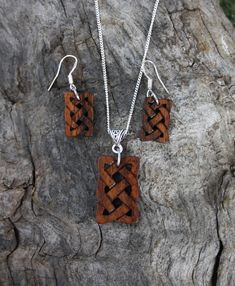 "This beautiful and unique hand-carved wooden Celtic knot jewelry set will be made for you, or a loved one, in my studio on the West of Ireland. These dainty rosewood Celtic necklace & earrings are recycled from musical instruments constructed by a local luthier. As a musician myself, I take enormous satisfaction in creating a jewelry set whose inherent wood has previously featured in a beautiful hand-made guitar. Also, part of rosewood's attractiveness is its durability and ability to stand Handmade Artisan Wood Jewelry, Artisan Handmade Wooden Jewelry, Artisan Wooden Jewelry As A Gift, Artisan Wood Jewelry Gift, Carved Wood Jewelry, Handmade Mahogany Jewelry For Gift, Traditional Mahogany Jewelry As Gift, Rustic Wooden Jewelry For Gifts, Rustic Wooden Beads Jewelry As A Gift