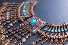 This exquisite piece combines the traditional motifs of ancient Egyptian design with the allure of oriental craftsmanship. Made from high-quality golden copper, this necklace exudes a radiant finish and is a perfect addition to any jewelry collection. Whether you're a lover of ancient history or simply seeking a unique and elegant piece, this Golden Copper Egyptian Authentic Oriental Necklace is sure to captivate. Wear it to celebrate the beauty and mystique of ancient Egypt and oriental artistr Bohemian Antique Finish Necklaces For Gifts, Bohemian Necklaces With Antique Finish For Gifts, Bohemian Necklace With Antique Finish For Gifts, Bronze Intricate Design Jewelry For Festivals, Bohemian Engraved Copper Necklaces, Traditional Bronze Necklace With Intricate Design, Traditional Bronze Necklace For Gift, Bohemian Bronze Jewelry With Intricate Design, Bronze Bohemian Ceremonial Necklaces