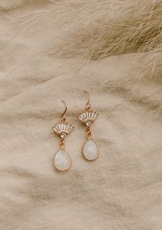 Our Aria Moonstone Earrings are simply beautiful. Made with genuine rainbow moonstone, they're made to stand out. They were designed for the classic, yet bohemian chic bride who wants a dainty look on her wedding day.FEATURES Genuine Rainbow Moonstone Teardrop set in gold vermeil or sterling silver Choice of Materials: 16k gold, rose gold, or sterling silver Ear wire is sterling silver or gold filled 100% nickel free, great for sensitive ears Chic Brides, Moonstone Earrings, Bohemian Chic, Sensitive Ears, Look On, Simply Beautiful, Ear Wire, Rainbow Moonstone, Gold Rose