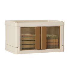 a white cabinet with two books in it