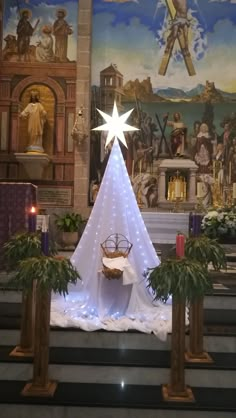 a christmas tree is in the middle of a church