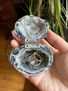 Important: Please double check the ring size before ordering if you intend to use this geode box for engagement ring as occasionally we have customers who forget to check the ring size and found that the ring couldn't fit in and had to return the order and waste money on SHIPPING COSTS AND 10% RESTOCKING FEES. Also The hinge to hold the geode box is glued on, and CAN get loose if twisted or over time. I have tried to drill and screw the hinge, but only resulted in damaging the geode. Another reason for not making the hinge permanently attached to the geode is because the geode will last Centuries , but the hinge won't. The value is based on the geode box, not the hinge. Therefore I don't guarantee the hinge won't come off. If this concerns you, please do not order this item. This listing i Geode Ring Holder, Geode Ring Box, Wedding Ring Boxes, Ring Box Engagement, Crystal Jewelry Box, Ring Box Wedding, Geode Ring, Geode Jewelry, Crystal Formations